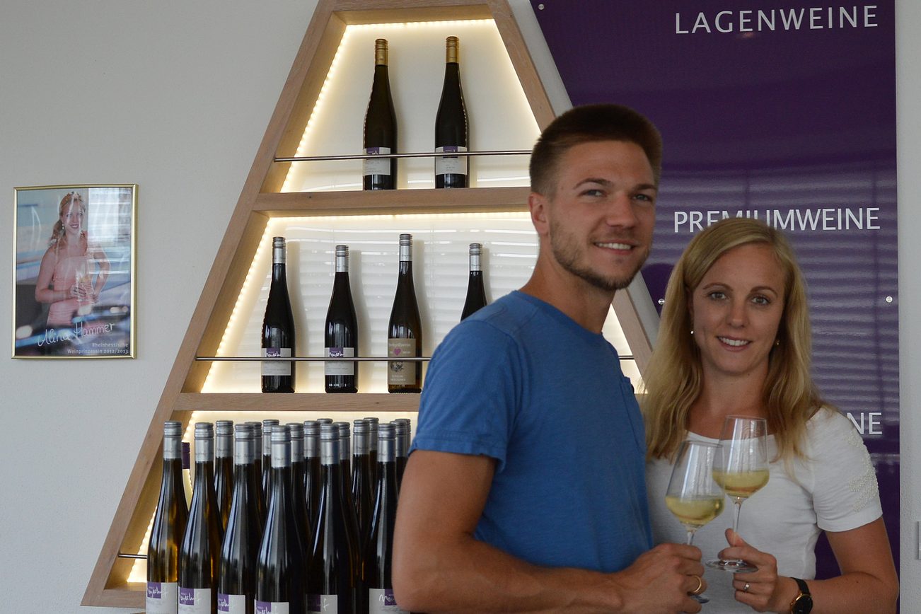 Sebastian and Alina Engel in front of the wine pyramid