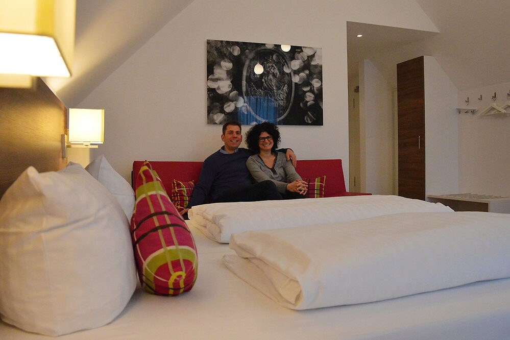 Chris and Alexander Baumann in a room at the Hotel Domhof.