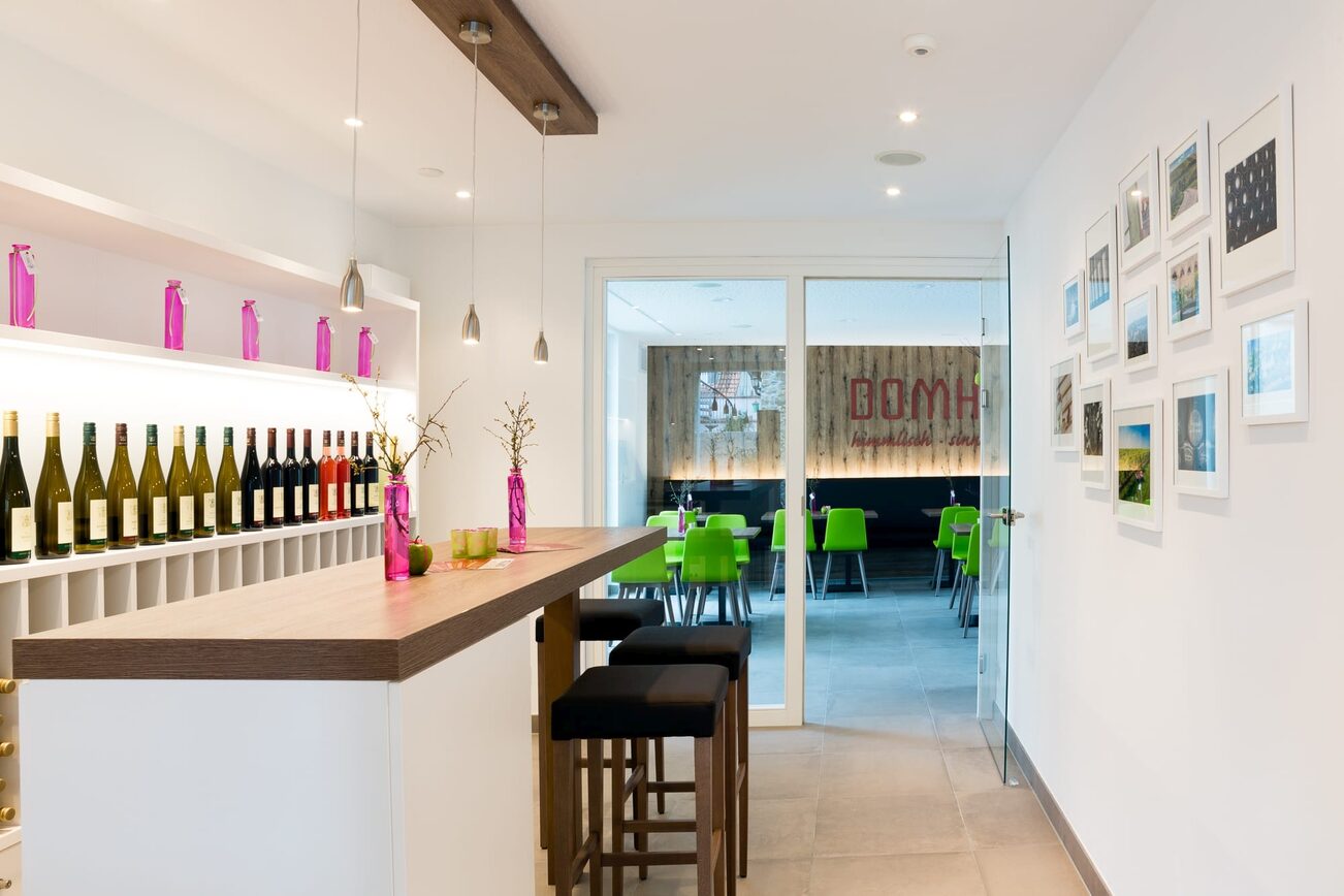Counter with wine bottles in the background