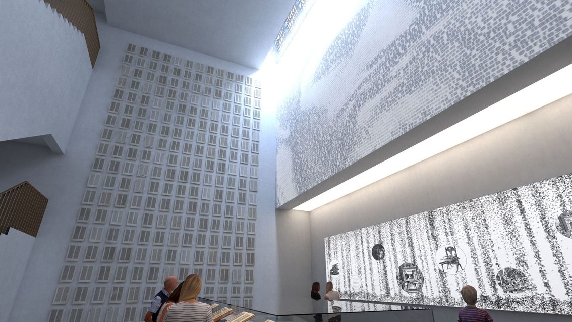 Zona de exposición de las Biblias de Gutenberg con visitantes.