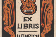 Bildergalerie Gutenberg-Museum "Grafik und Exlibris"  The bookplate of the scholar Heinrich Meier, designed by J.C. Buser-Kobler shows an African mask framed by two demons to its left and right. Undated woodcarving.