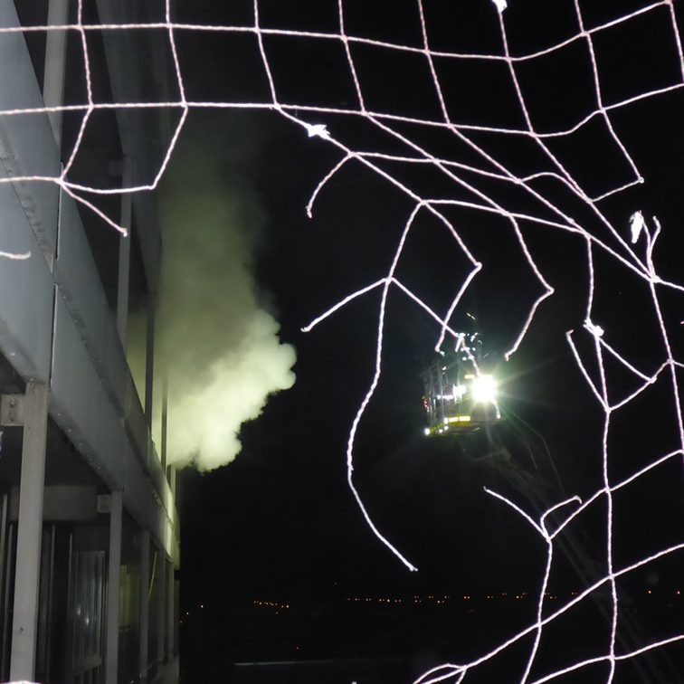 Smoke escapes from the building.